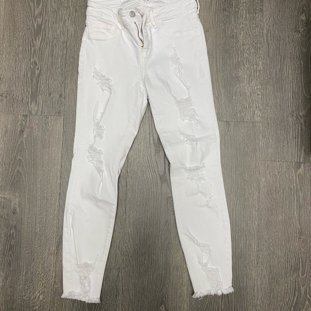 Women distressed white jeans